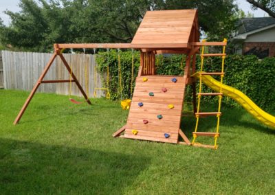 Farm-and-yard-tx-Toucan-Playcenter-w_-wood-roof-and-Yellow-Wave-Slide-Customer-1