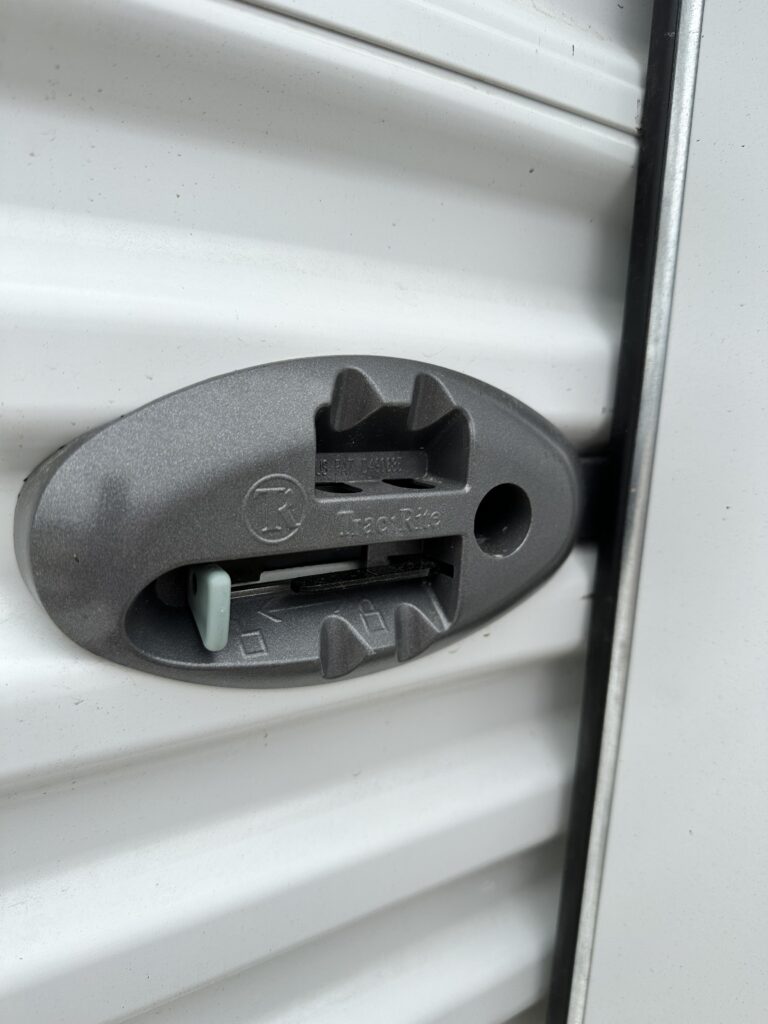 sliding garage door latch with space for padlock 