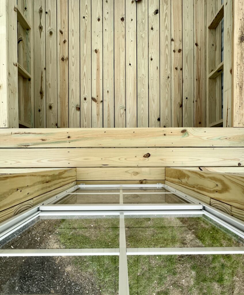 top down view of planter shelving inside the 8x10 Gambrel Greenhouse 