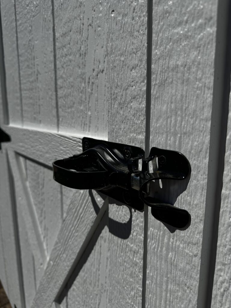 Predator proof man door latch